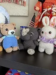 Crochet bear, rhino and bunny on a shelf